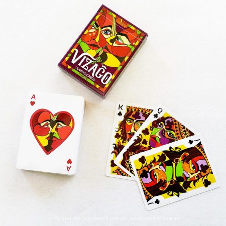 Ace of hearts on top of deck pile with royal clubs and tuck box on the side