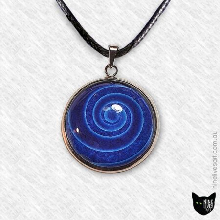 Blue spiral pendant set with 25mm glass cabochon