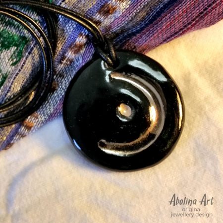 Black and lustre stoneware clay pendant with Moon symbol