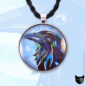 Blue raven artwork sealed under glass cabochon with antique silver metal pendant setting and black cord