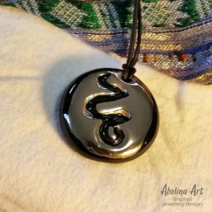 Platinum lustre stoneware snake pendant