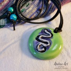 Green stoneware pendant with silver snake