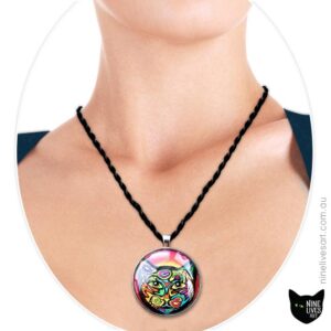 Model wearing 40mm art pendant Psychedelic Cat in bright colours