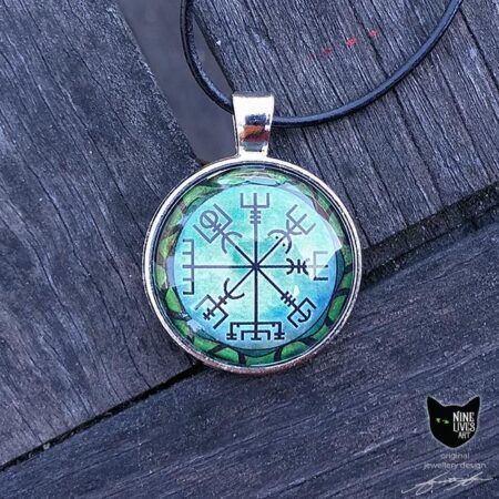 Art pendant featuring viking symbol Vegvisir on green background with snake encircling
