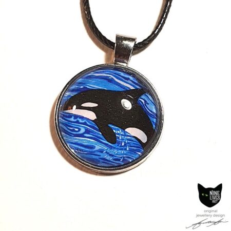 Artwork depicting Orca diving in ocean waves - 25mm silver coloured pendant setting with glass cabochon