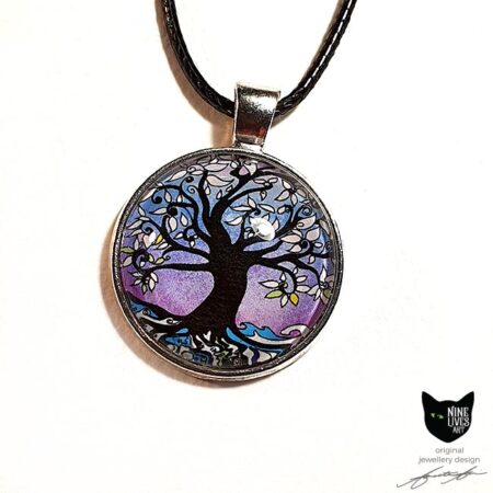 Art pendant featuring tree of life surrounded by lilac winter hues. Silver coloured pendant setting with glass cabochon