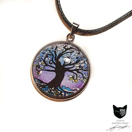 Art pendant featuring tree of life surrounded by lilac winter hues. Stainless steel pendant setting with glass cabochon