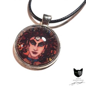 Art pendant featuring detail from Nine Lives Tarot - The Devil, sealed under glass dome with bezel setting