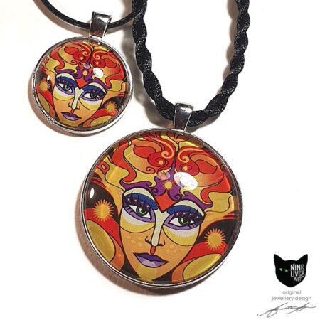 Art pendants featuring sun goddess in vibrant warm colours, sealed under glass dome with silver coloured bezel and pendant cord
