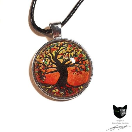 Autumn colours define this original tree of life art pendant set in a silver coloured bezel and sealed under glass cabochon