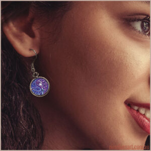 Model wearing 12mm purple paisley earring - French hook style