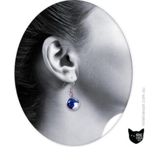 Model wearing 12mm blue raven earring