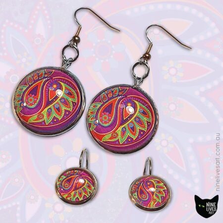 Magenta lime themed paisley earrings displayed on artwork background