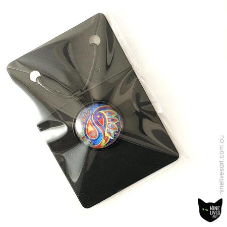 Paisley pendant displayed on black jewellery card in clear packaging