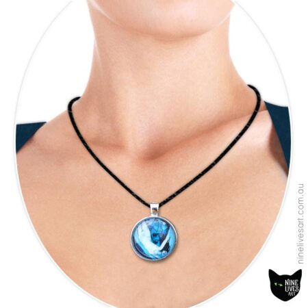 Model wearing ocean inspired blue art pendant