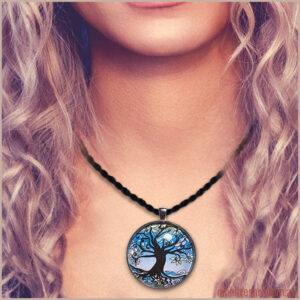 Model wearing 40mm Tree of Life art pendant in frost blue colours