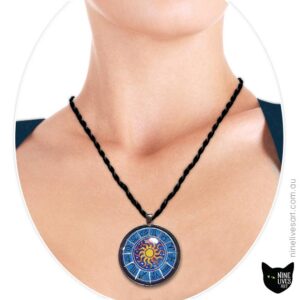 Model wearing 40mm Zodiac pendant on blue with sun in centre