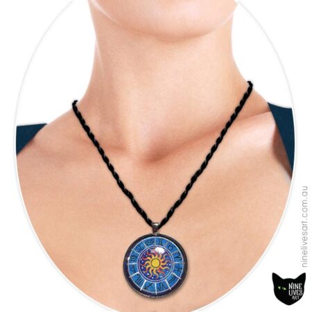 Model wearing 40mm Zodiac pendant on blue with sun in centre