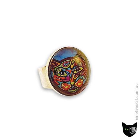 25mm cabochon ring featuring bold and colourful cat artwork