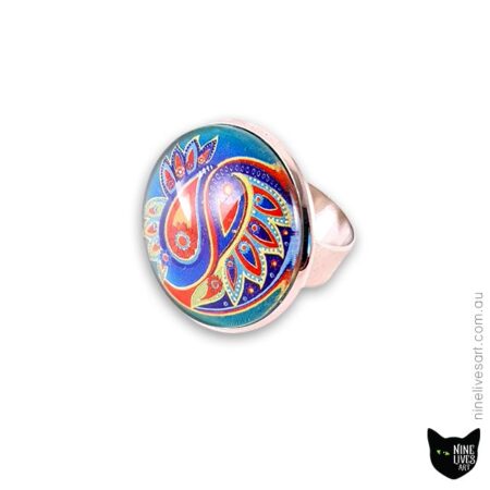 25mm cabochon ring in original paisley design featuring bright colours on jade background