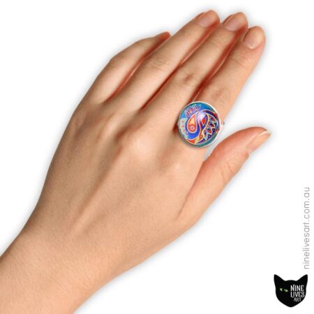 Model wearing 25mm cabochon ring with paisley design