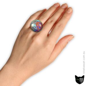 Model wearing 25mm cabochon ring featuring paisley artwork in turquoise hues