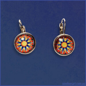 Sun Mandala 12mm earrings on blue background