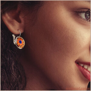 Model wearing Sun Mandala earrings