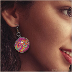 Model wearring 25mm paisley earring in pink and green