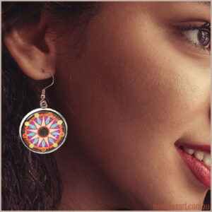 Model wearing Sun Mandala earring - French hook setting