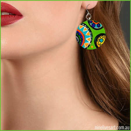 Model wearing green Circus earring - hand-painted