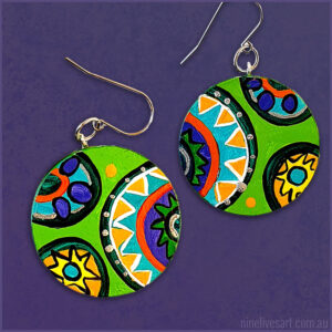 Circus Green earrings 40mm hand-painted - displayed on purple background