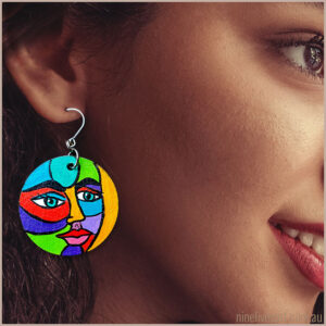 Model wearing hand-painted face earring