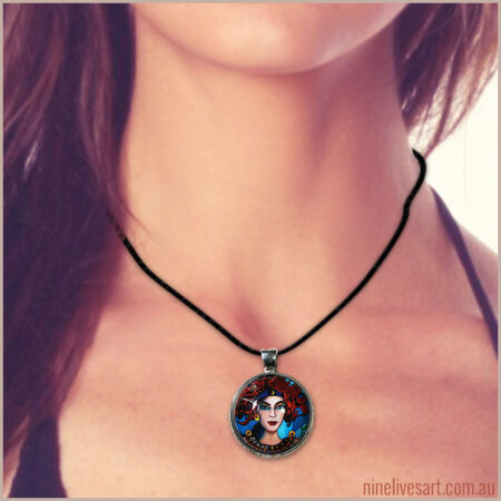Model wearing art pendant inspired by The Chariot from Nine Lives Tarot