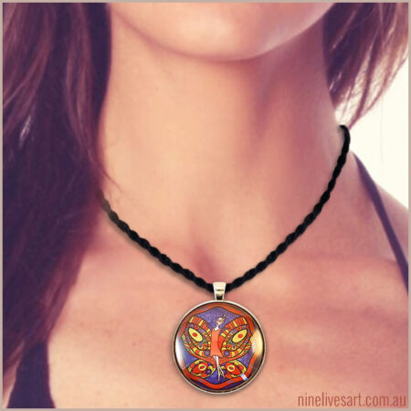 Model wearing 40mm Fairy pendant in red and purple colours