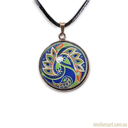 Paisley pendant in green and blue colours strung on cord