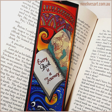 Art bookmark by Abolina Art shown on open page of a book