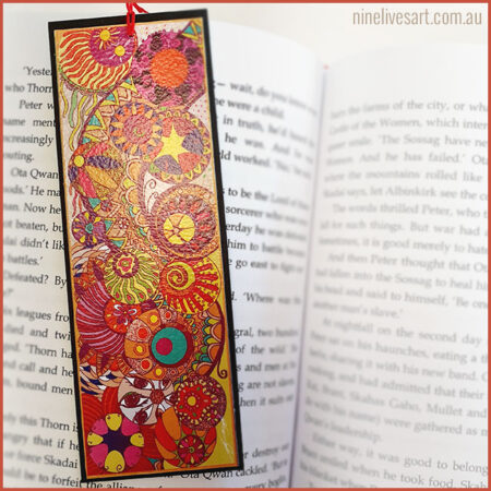Colourful art bookmark featuring line drawing of circles painted in warm summer tones