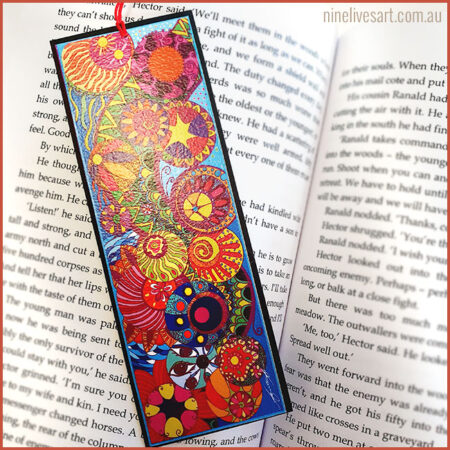 Colourful art bookmark featuring line drawing of circles painted in vivid blues