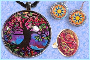 Art pendant, earrings and ring featuring colourful designs and artwork